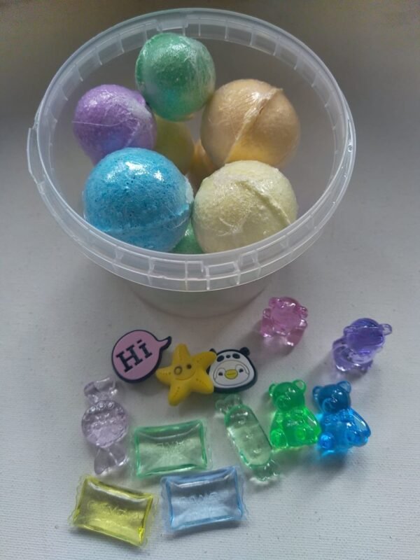 Small bucket of bombs with toys